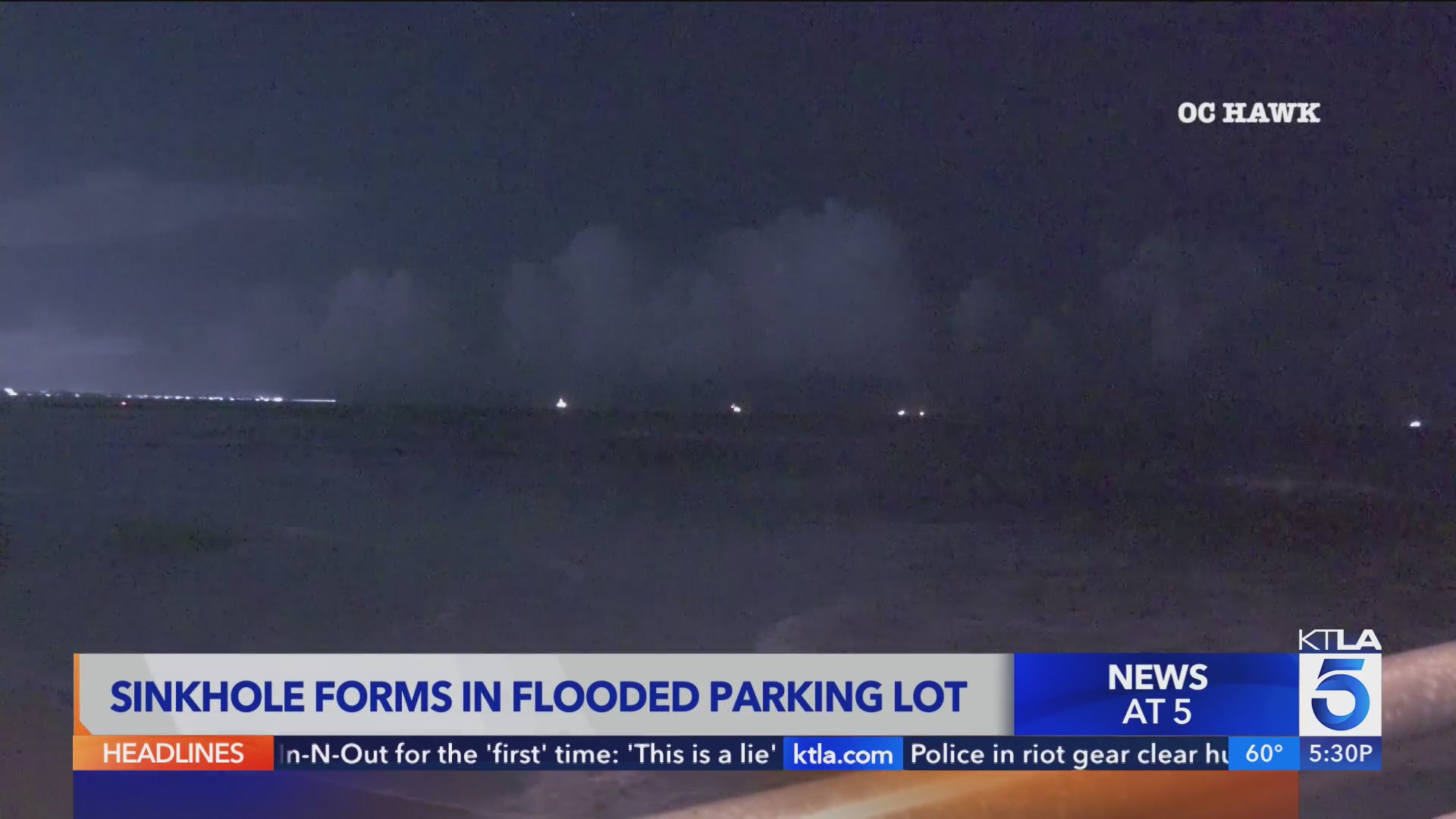 Sinkhole forms in flooded Seal Beach parking lot KTLA