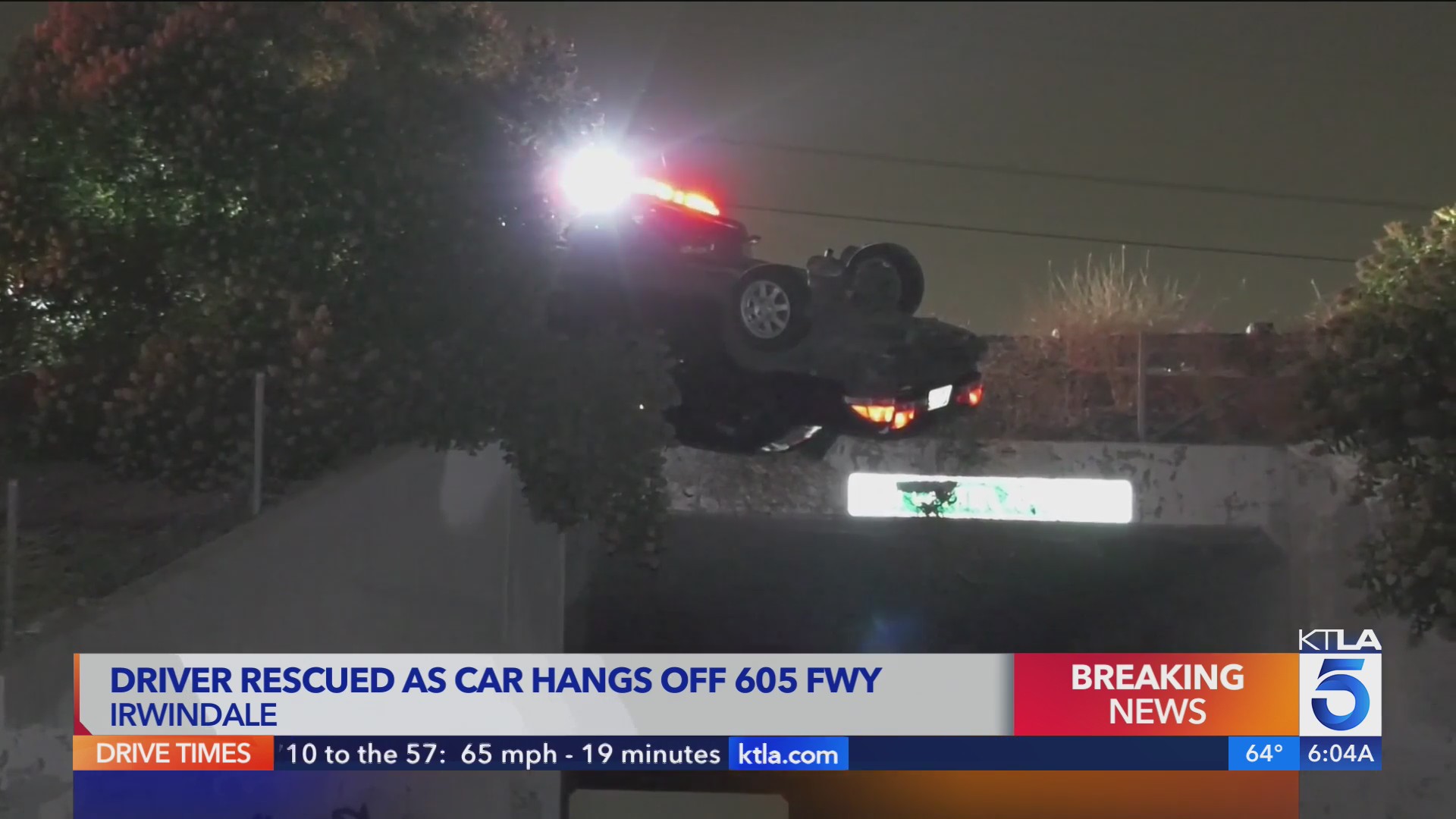 Driver rescued from overturned vehicle hanging off side of 605 Freeway ...