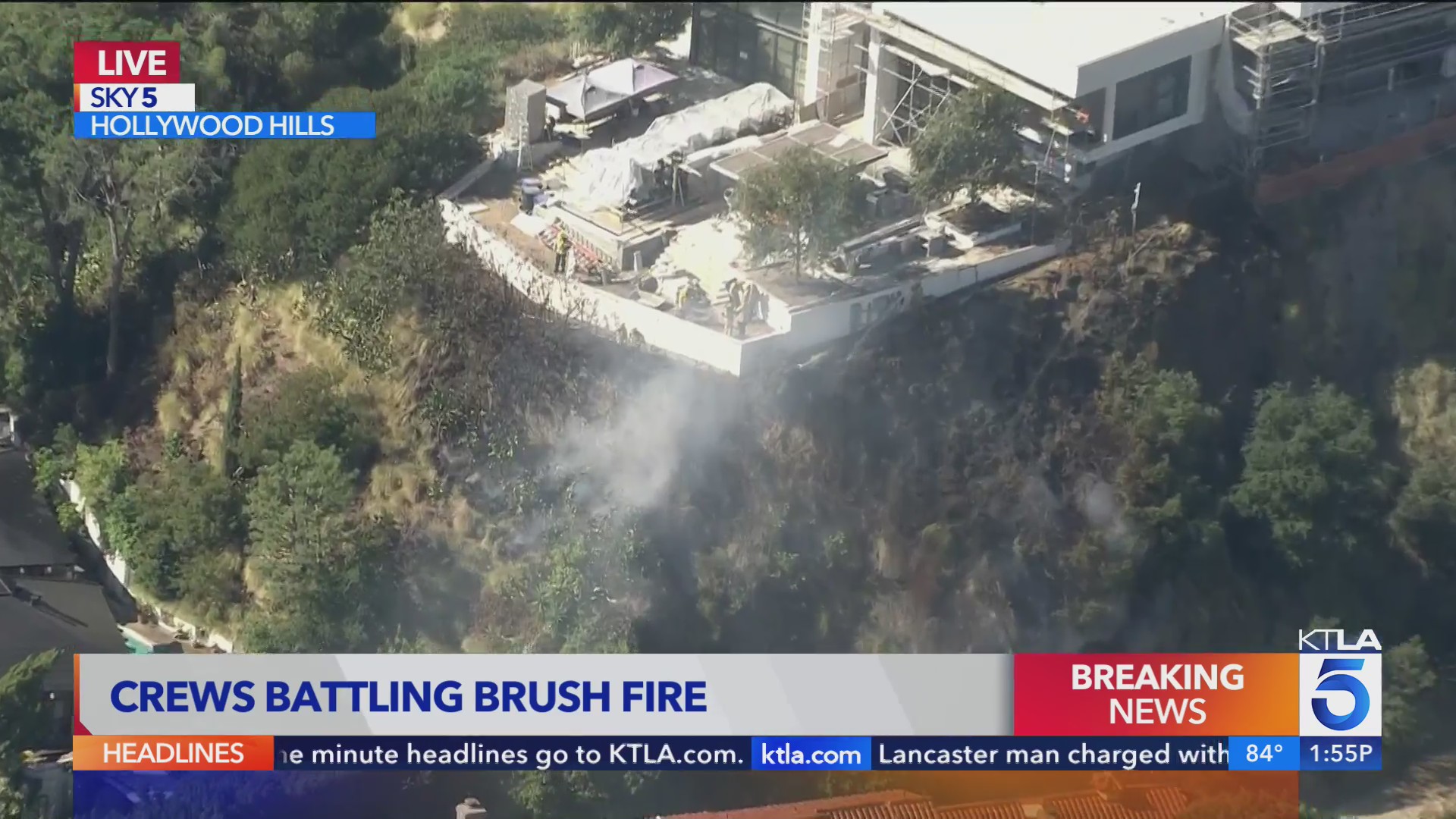 Firefighters battling blaze beneath Hollywood Hills homes