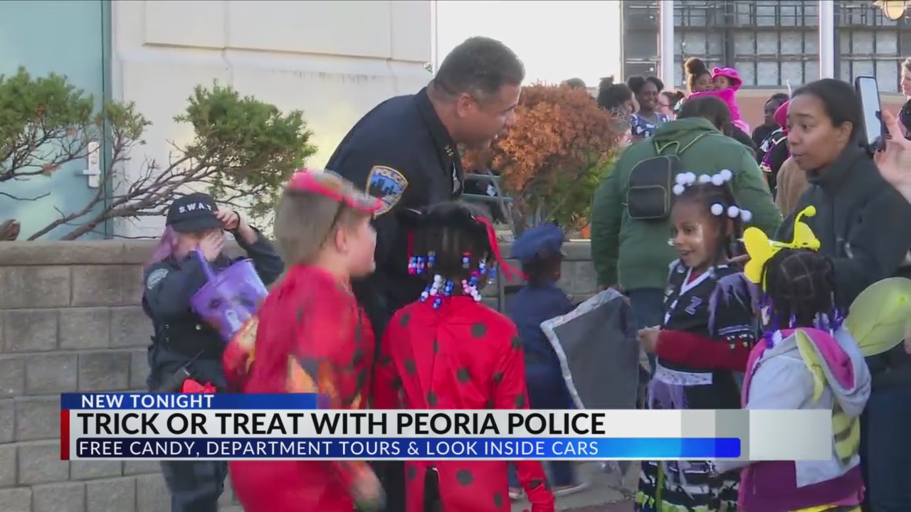 Ghouls and goblins trick or treat with Peoria Police, city hall